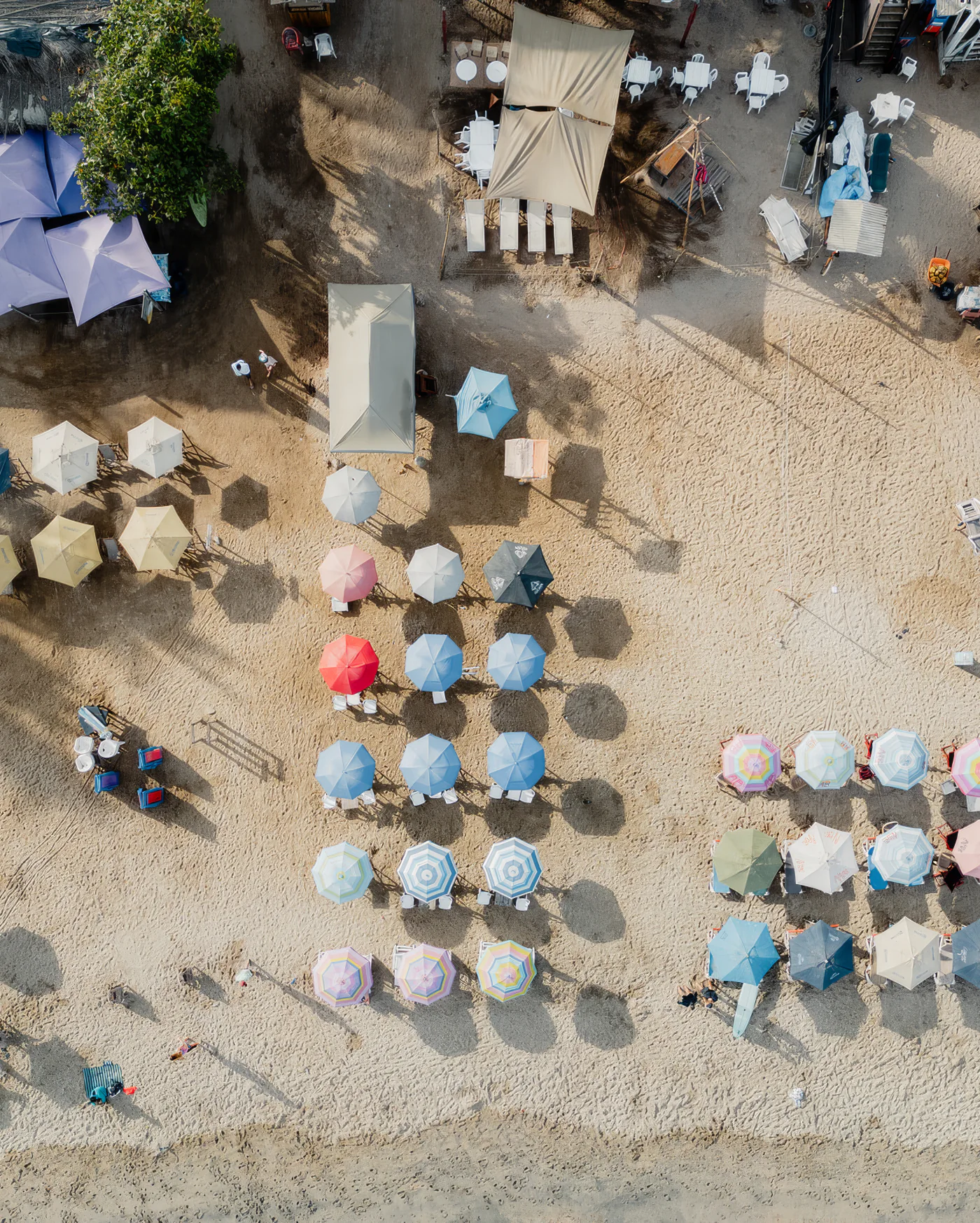 Beach umbrellas on Sayulita’s sand, seen from above